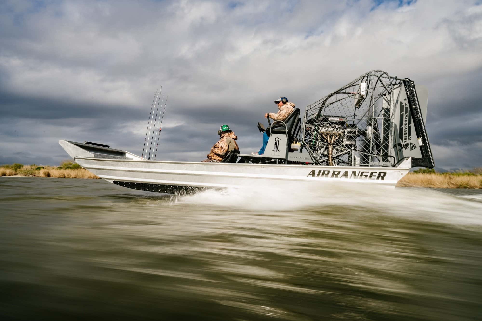 An airboat skating across choppy water at high speeds