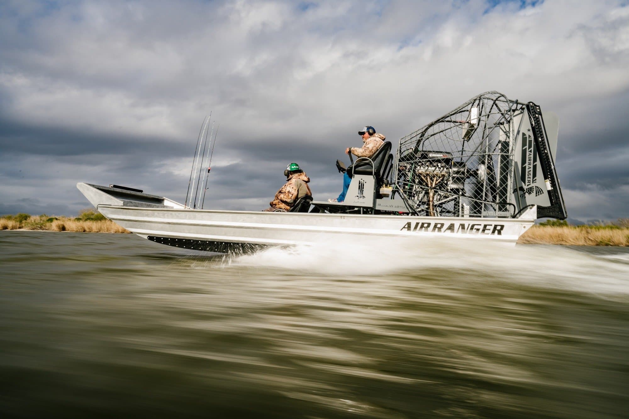 An airboat skating across choppy water at high speeds