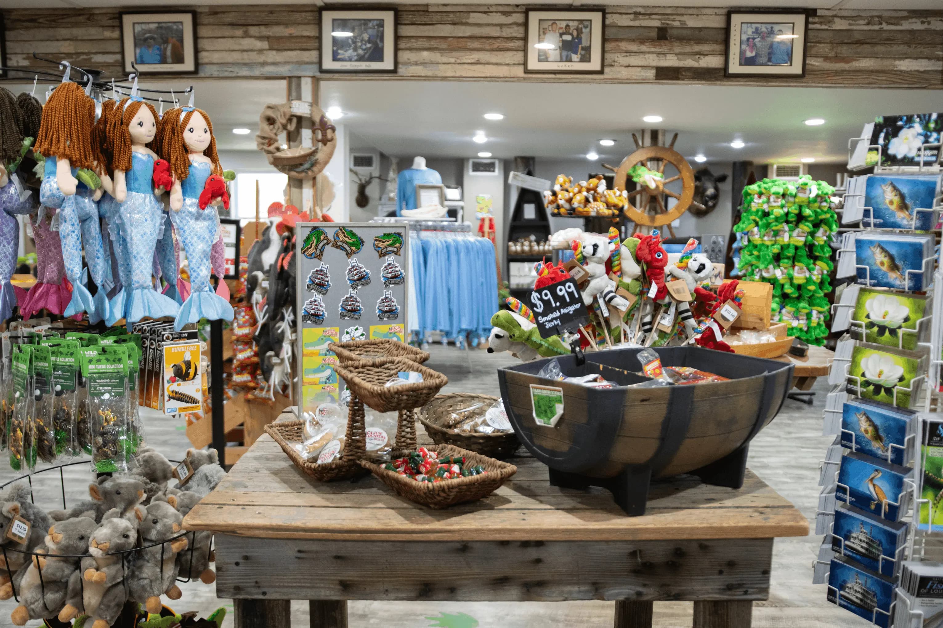 A wide-set photo of Cajun Encounter's Gift Shop, featuring a table with swamp-themed knick-knacks