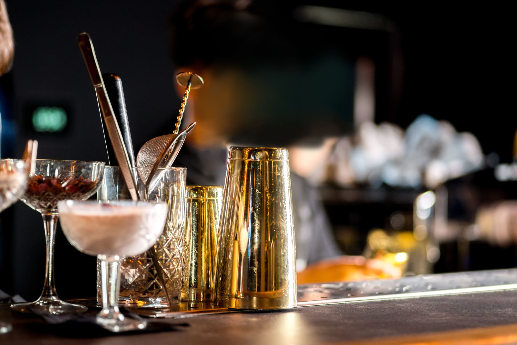Prohibition in New Orleans cocktails and bartender's equipment on a bar top
