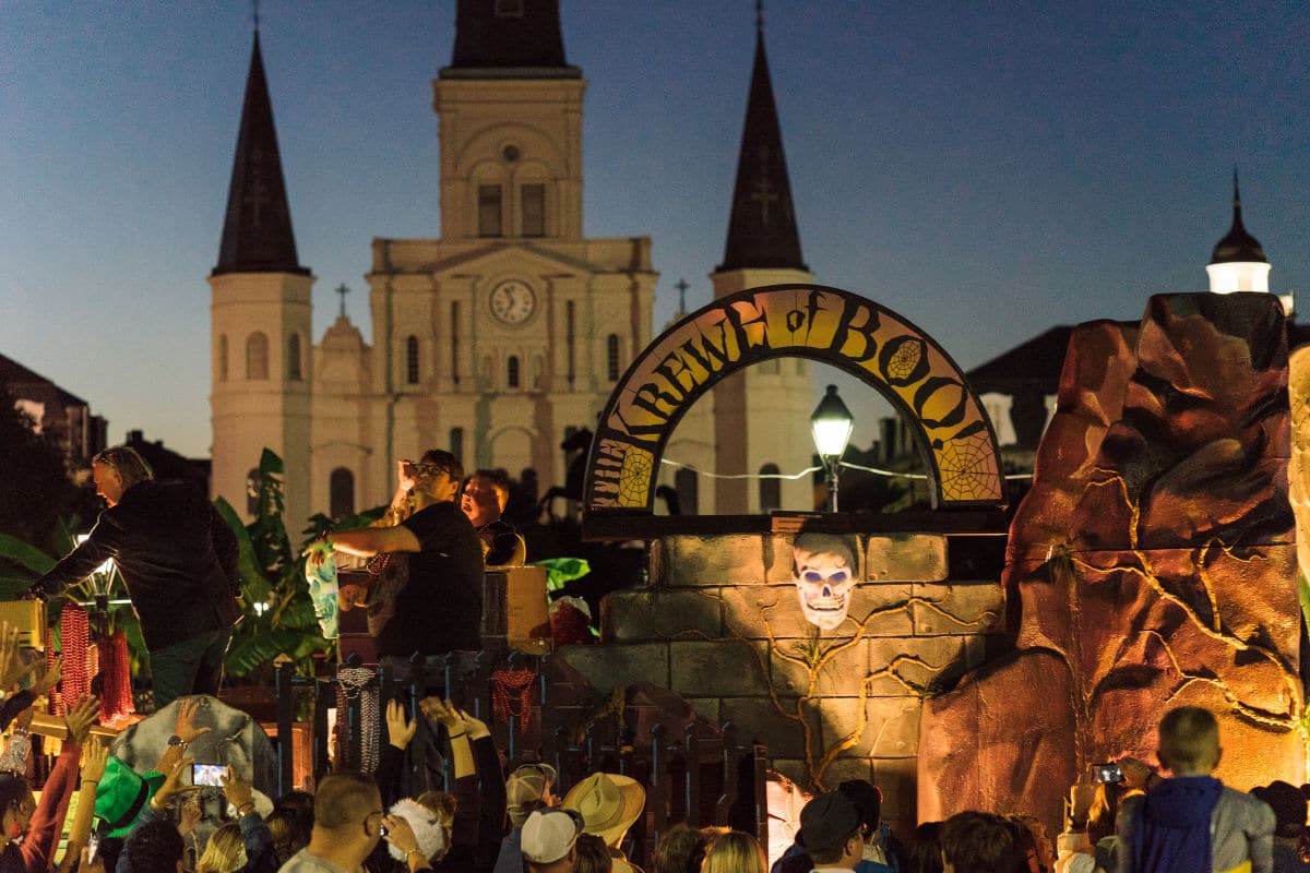 new orleans halloween parade krewe of boo! slogan by the St. Louis Cathedral