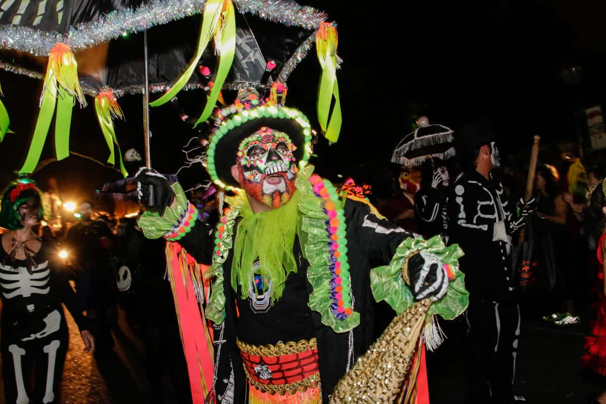 things to do in New Orleans for Halloween person dressed up with an umbrella and face paint