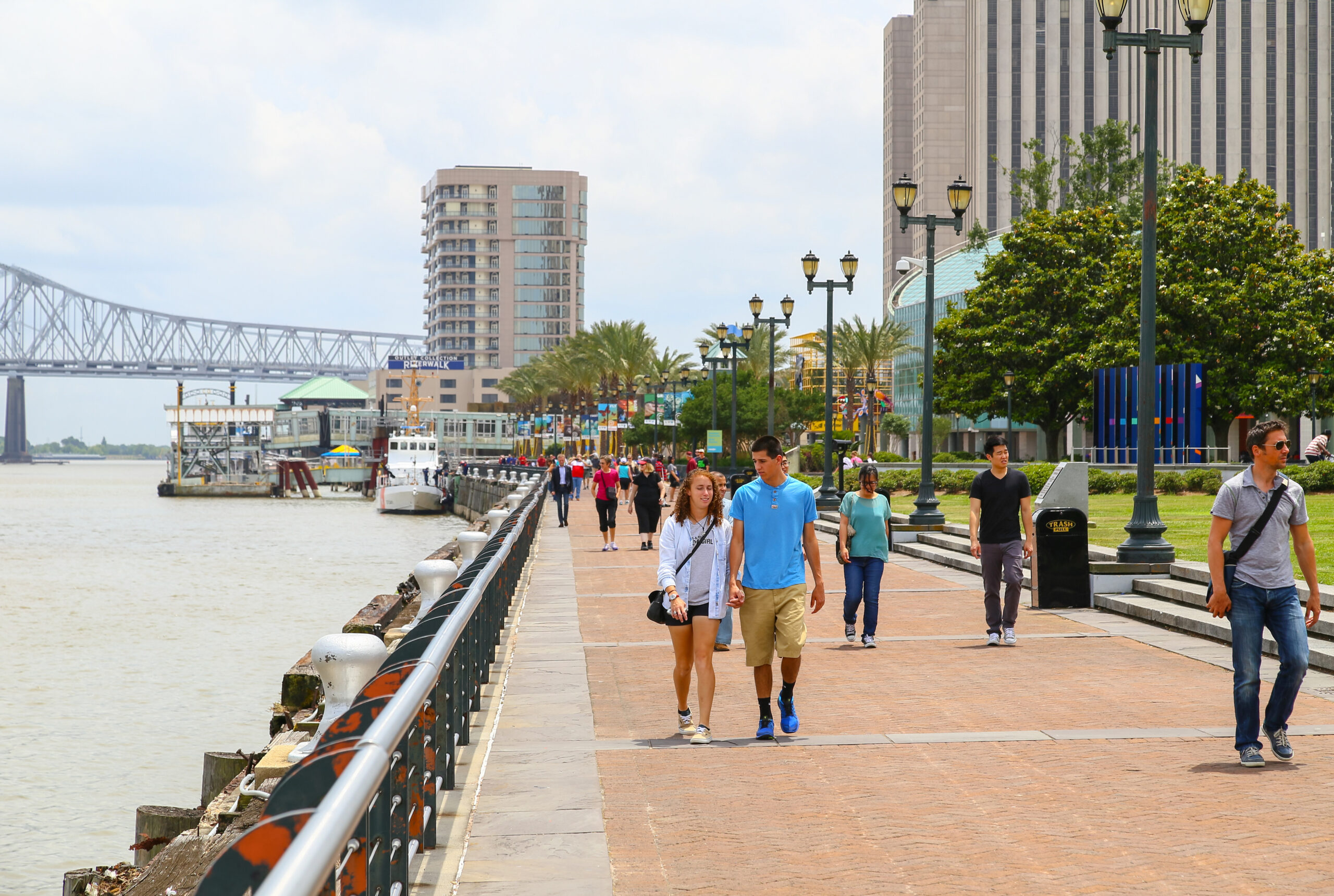 Couples walking along the Riverwalk during Valentine's Day in New Orleans